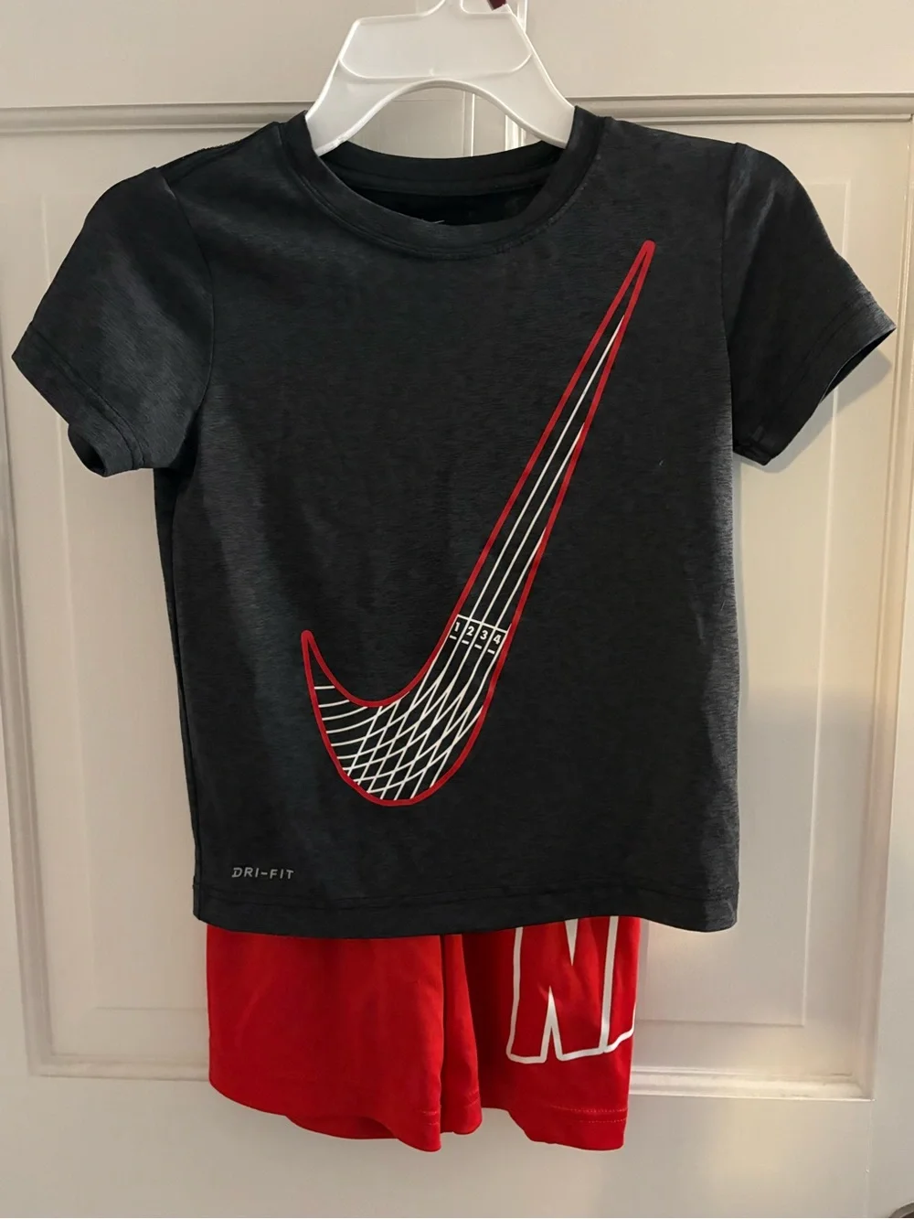 Nike Black Short Sleeve Tee with Red Swoosh Accent